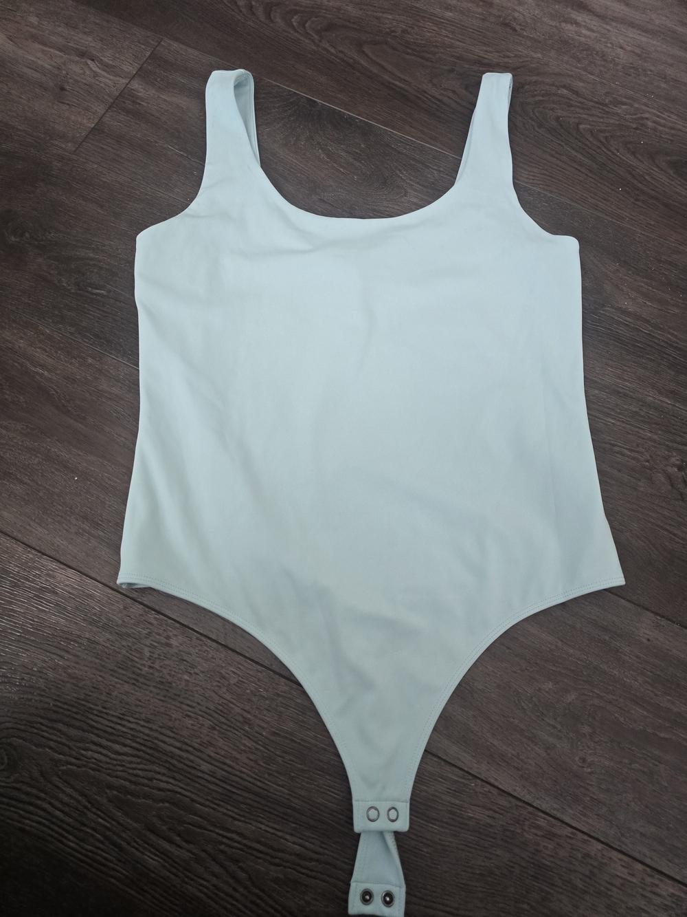 Women's Light Blue One-Piece Bodysuit with Snap Closure